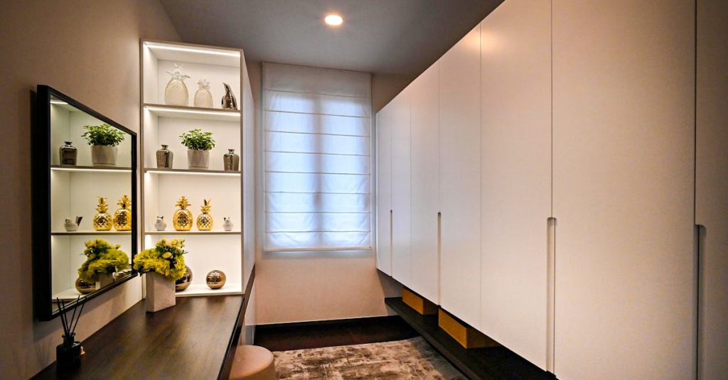 Stylish and minimalistic dressing room interior with sleek cabinets and decorative elements.
